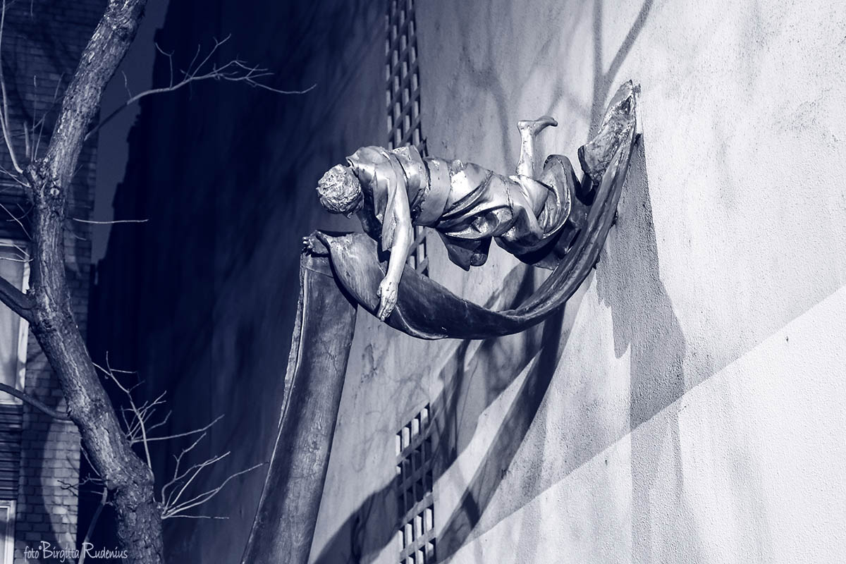 Blue Statue on the Wall